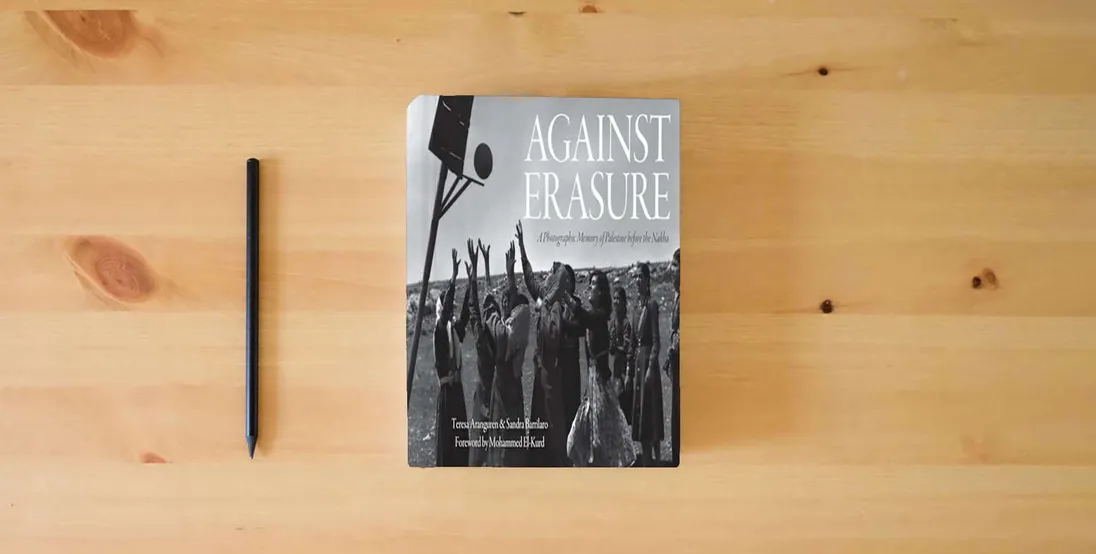 The book Against Erasure: A Photographic Memory of Palestine Before the Nakba} is on the table