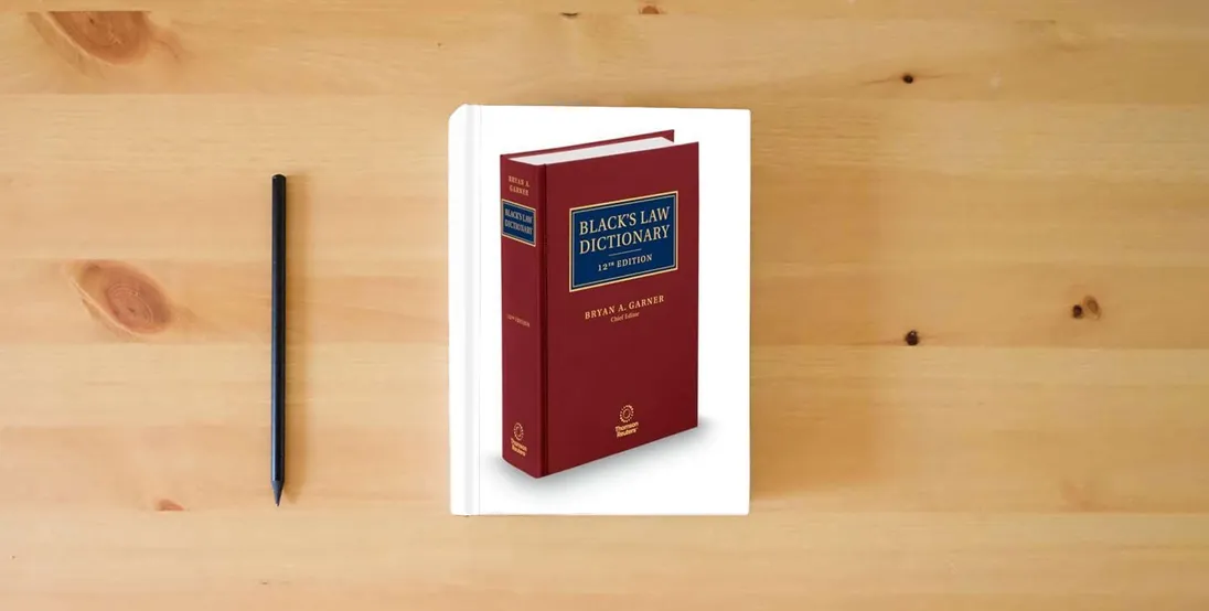 The book Black's Law Dictionary, 12th Edition} is on the table