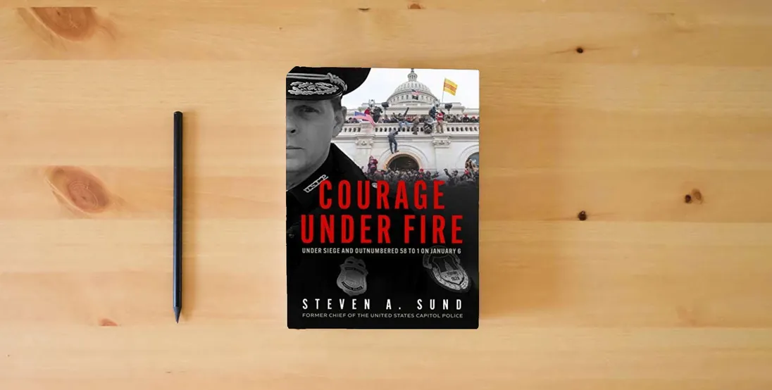 The book Courage Under Fire: The Definitive Account from Inside the Capitol on January 6th} is on the table