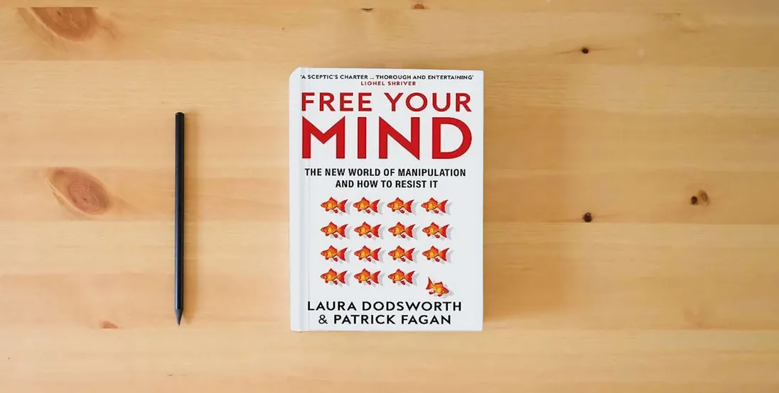 The book Free Your Mind: The must-read expert guide on how to identify techniques to influence you and how to resist them} is on the table