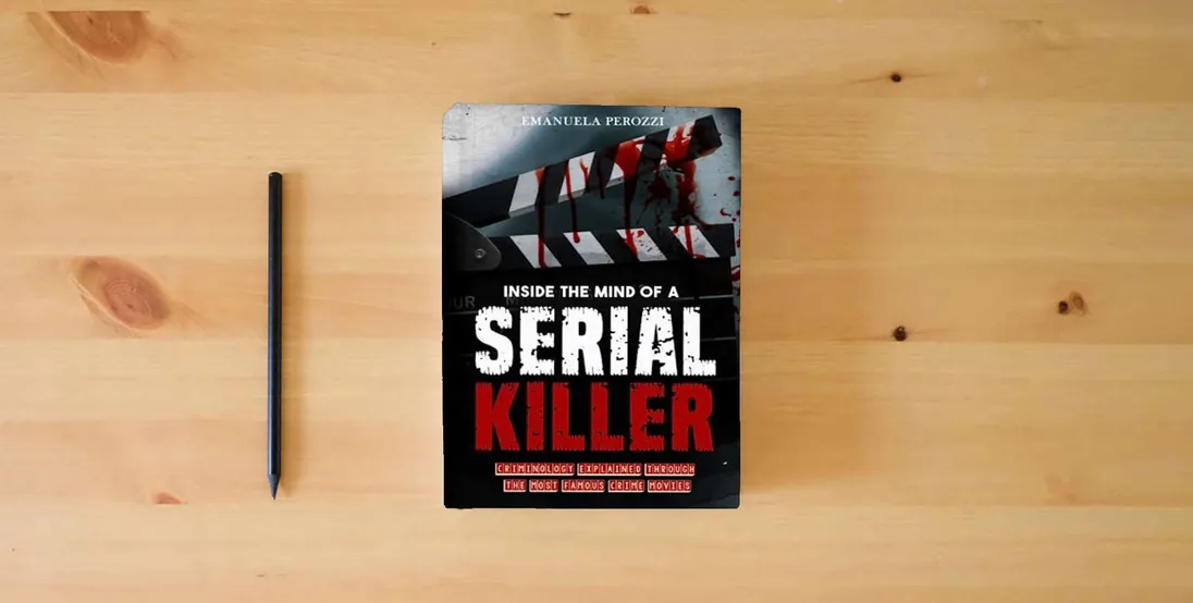 The book Inside the Mind of a Serial Killer: Criminology explained through the most famous Crime Movies} is on the table