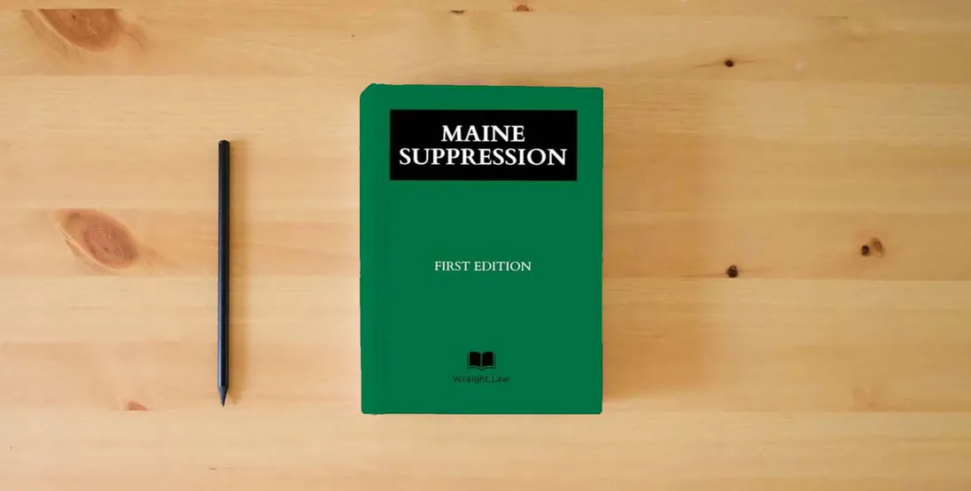 The book Maine Suppression} is on the table