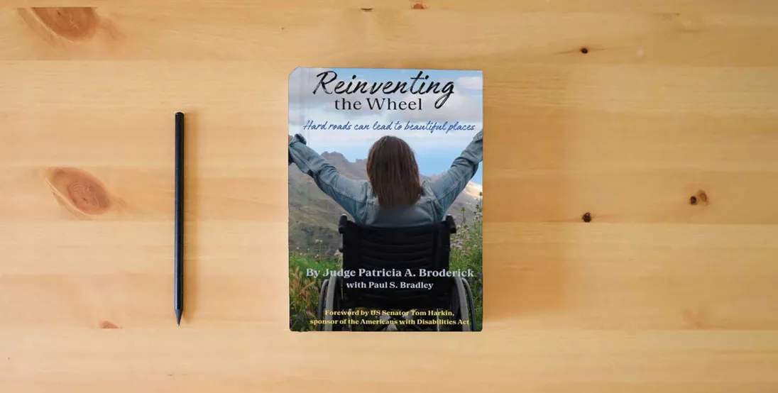 The book Reinventing the Wheel: Hard Roads Can Lead to Beautiful Places} is on the table