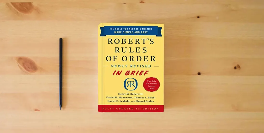 The book Robert's Rules of Order Newly Revised In Brief, 3rd edition} is on the table