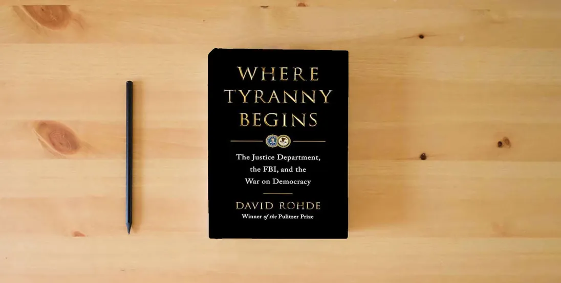 The book Where Tyranny Begins: The Justice Department, the FBI, and the War on Democracy} is on the table